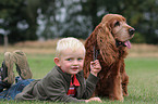 Junge und Cocker Spaniel