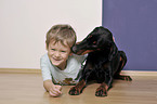 Junge mit Dobermann