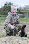 Junge und Hollandse Herder Welpen