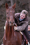 Frau reitet American Saddlebred Horse