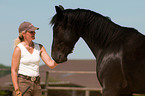 Frau mit Belgischem Warmblut