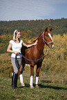 Frau mit Deutsches Reitpony