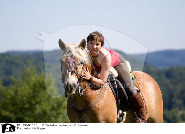 Frau reitet Haflinger / woman rides Haflinger horse / EH-01535