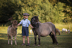 Junge und Ponys