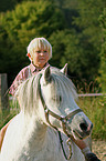 Junge und Pony